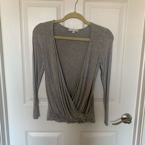 Grey deep v neck long sleeve shirt. Size XS.